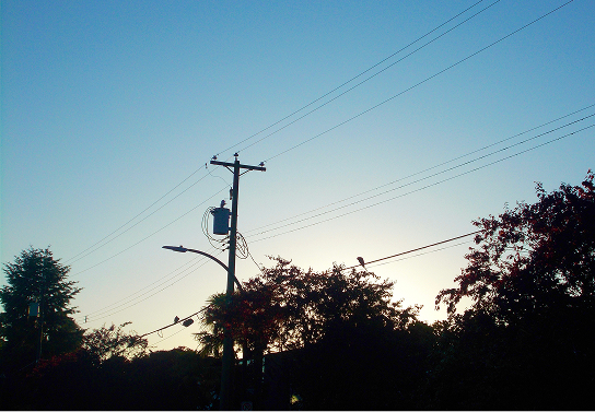Power lines silhouetted at dusk